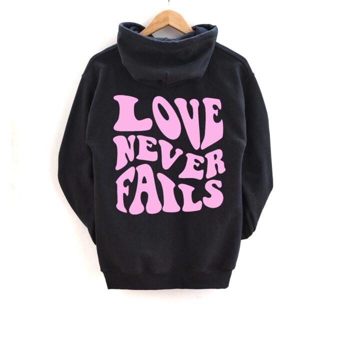 Love Never Fails Hoodie, Trendy Sayings On Back Positivity Quotes Bible Christian Hoodies, Unisex