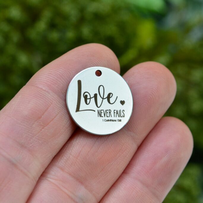 Love Never Fails, 1 Corinthians 138 Bible Verse Custom Laser Engraved Stainless Steel Charm Cc1169