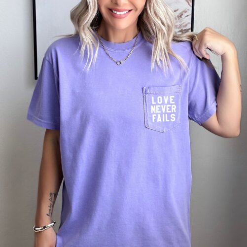 Love Never Fails Comfort Colors Pocket Shirt | Christian Apparel, Faith Clothing, T-Shirt, Gift, Colors T-Shirt