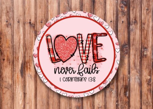 Love Never Fails Pink Wreath Sign