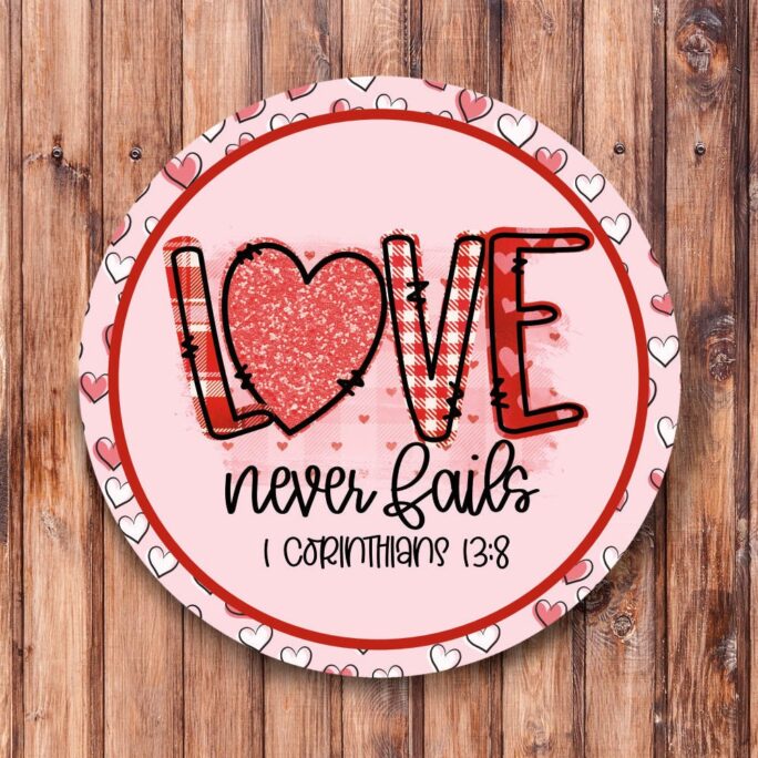 Love Never Fails Pink Wreath Sign
