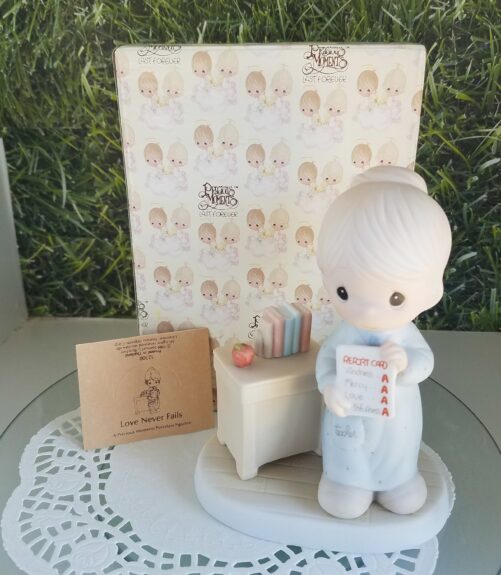 Love Never Fails Precious Moments Figurine